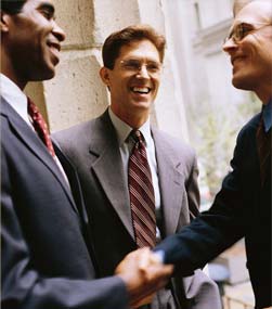 job applicant shakes hands with employers