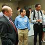 U.S. Sen. Chris Coons (D-DE) talks with students during a reception thumbnail