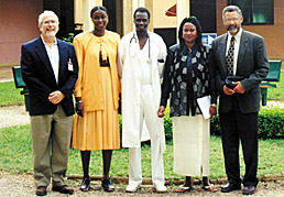 Dennis Matthews (extreme left) and Kennedy Reed (extreme right) with hospital staff members during visit to Yoff Hospital in Dakar to discuss interests in medical applications of lasers