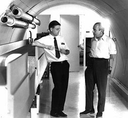 Robert R. Wilson (left) confers with Edwin L. Goldwasser during the early days at the National Accelerator Laboratory.