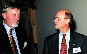 Albert Narath (l) speaks to John Pace VanDevender (r) as Fellows enjoy each other's company at the reception.