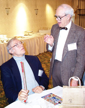 Ted Schultz, right, makes a point to Wolf Berger at one of the TSA Institutes