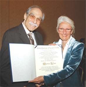 The APS has awarded the Pais Prize, named after the late distinguished physicist and historian Abraham Pais, for the first time at its April Meeting in Tampa. The Prize recognizes outstanding scholarly achievements in the history of physics, and the inaugural recipient was Martin J. Klein, Eugene Higgins Professor Emeritus of Physics and History of Science at Yale. In the photo Klein (left) and Ida Nicolaisen, widow of Abraham Pais, hold the Pais Prize certificate. The Prize was established in collaboration with the Center for History of Physics of the American Institute of Physics.