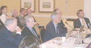 Listening to a presentation at the HEPAP meeting are (l to r) : Presidential science advisor John Marburger; DOE Office of Science Associate Director for High-Energy Physics Robin Staffin; HEPAP Chair Melvyn Shochet; NSF Director Arden Bement (partially obscured); and NSF Physics Division Director Joseph Dehmer.