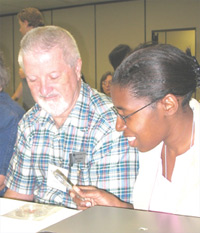 At an APS High School Physics Teachers' Day workshop in Dallas, William Griffith and Kendra Bonnet explored fractal patterns in a crystal that they had just grown. The workshop was led by Richard Olenick of the University of Dallas.