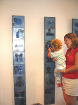 18-month old Chloe Rand got a chance to feel the glass panels of the art work, 'A new World View